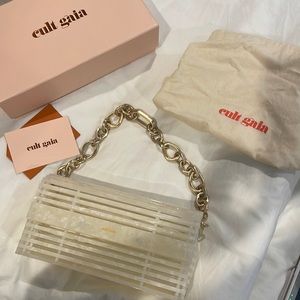 Cult Gaia pearl color bag with gold chain